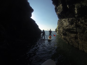 Multi tasking  SUP'ing and collecting fishing bouys from the back of caves!